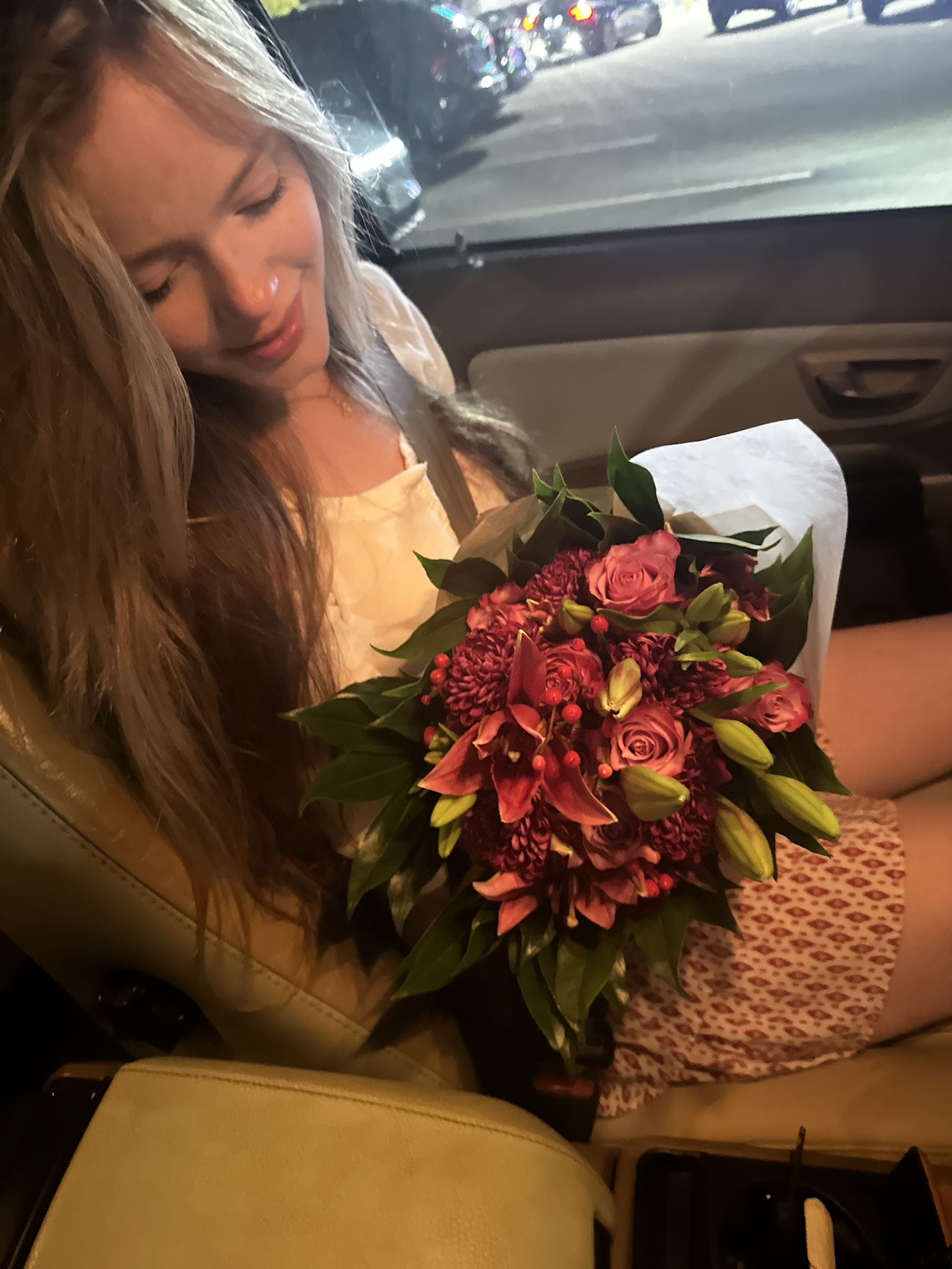 Elle holding a beautiful bouquet of flowers